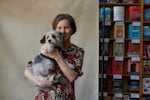 Author Ann Patchett holds her dog, Sparky, in the bookstore she owns.