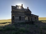 Sun peeks through the roof of the Charles Nelson House.