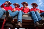 From left, Happy Canyon board members Bobby Corey, Ben Haney, Christopher Stuvland and Casey Hunt sit in a wagon and enjoy cigars before the Westward Ho! Parade through downtown Pendleton, Ore., during the Pendleton Round-up on Sept. 18, 2026.
