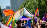 Pride flags waving in Portland's Pride Parade on July 16, 2023. 