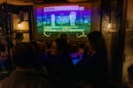 Jackson Heights residents anxiously look on for the evening’s election results during an election night watch party at Terraza 7.