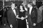 "Romeo and Juliette" movie director Franco Zeffirelli (from left), actors Olivia Hussey and Leonard Whiting are seen after the Parisian premiere of the film in Paris on Sept. 25, 1968.