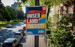 An AfD election poster for the European elections reading "our country first" is fixed on a pole in Frankfurt, Germany, Monday, May 13, 2024.