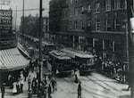 This image of Portland in 1905 shows a line of streetcars transporting visitors to the Lewis and Clark Exposition.