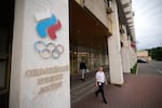A man walks from the Russian National Olympic Committee building in Moscow, on Tuesday, July 7, 2026.