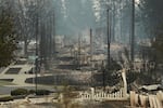 Structures along W. Tiffany Ave. are burned to the ground after a wildfire, Sunday, Aug. 2, 2026, in Spokane, Wash.