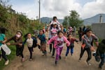 Ana Hernández, coordinator of the association Coincidir, an organization formed by activists for the rights of children, adolescents and youth, plays with a group of girls in the village of Panimaquín, Guatemala, May 6, 2022. Photo/Luis Echeverria