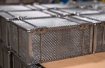 Marlin Steel makes specialized wire products, like these baskets seen at its Baltimore factory, used by pharmaceutical, food processing and aerospace companies in North America, Europe, and Asia.