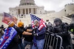 Trump supporters try to break through a police barrier, Wednesday, Jan. 6, 2021, at the Capitol in Washington. As Congress prepares to affirm President-elect Joe Biden's victory, thousands of people have gathered to show their support for President Donald Trump and his claims of election fraud.