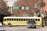 A parked school bus blocks the public's view of the damage caused in a Christmas Day explosion Monday, Dec. 28, 2020, in downtown Nashville, Tenn.