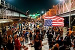 Demonstrators march on the Williamsburg Bridge during a protest, Wednesday, Sept. 23, 2020, in New York, following a Kentucky grand jury's decision not to indict any police officers for the killing of Breonna Taylor. (AP Photo/Eduardo Munoz Alvarez)