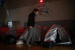 Itay Siegel, whose aunt Aviva was freed and uncle Keith remains hostage, prepares to sleep in a gym at Kibbutz Tsor'a with other families on March 1. "I want to make sure that in this story, there is a chapter about - kedushat ha-hayyim – about the importance of life – that life is much more important than death, it's much more important than ego, it's much more important than land," Siegel said.