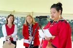 CEO of The Historic Trust, Temple Lentz, left, and Anne McEnerny-Ogle, mayor of Vancouver, center, watch Duana Ricks, a Colville-Lakes tribal member give a blessing during the America 250 celebration at Fort Vancouver in Vancouver, Wash. on July 3, 2026.