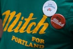 A volunteer canvasser for Portland City Council District 4 Councilor Mitch Green’s campaign shows his support at Johnson Creek Park in Portland, Ore., on Sept. 15, 2026.