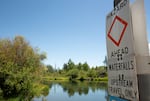 A sign warns river users of nearby danger at the Dillon Falls boatramp in Deschutes County, Ore. on July 29, 2025.
