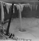 This photograph from 1923 by June D. Drake shows Silver Falls State Park's South Falls in winter. Notice the people just to the bottom left of the image.