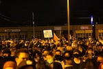 Vigil attendees stand and listen to a speaker Oct. 30 while memorializing Kevin Peterson Jr. Peterson was killed by Clark County Sheriff's Office deputies the night before.