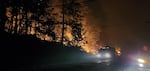 An image of a fire truck alongside a fire on the side of the highway in Gates on Sept. 7, 2020.