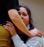 Muffie Delgado Connelly rehearses choreography with the Portland Yelling Choir on Oct. 29, 2024. They said joining the choir has helped them process complicated emotions in a group setting.