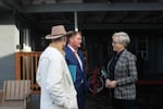 From left, Astoria Mayor Sean Fitzpatrick, Clatsop County Commission Chair Mark Kujala and Gov. Tina Kotek talk about coastal needs at the Columbia Inn, a shelter in Astoria.