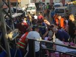 Health workers carry a man who was wounded after when a pager exploded in Lebanon's southern port city of Sidon.