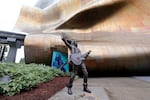 A life-size, bronze statue of late Soundgarden frontman Chris Cornell stands outside the Museum of Pop Culture a day after its unveiling, Monday, Oct. 8, 2018, in Seattle.