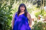 Rhonda Lee Grantham, founder of the Center for Indigenous Midwifery, stands in the Wild Hearts Farm’s garden after a successful Milk Medicine Gathering and Celebration in Tacoma on Aug. 7, 2022.