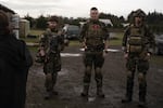 Noah Wenger, Andrew Pollmann, and Alex Bates listen to the rules before playing an AirSoft game at Action Acres AirSoft on March 23, 2019, in Canby, Ore.