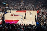 Portland Trail Blazers guard Damian Lillard, right, shoots and makes his first three-point shot in his first game back in action for the Blazers in their season opening game against the Phoenix Suns at the Moda Center in Portland, Ore., on Oct. 21, 2026.