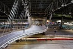 A person walks into Portland International Airport on Thursday, April 9, 2020, in Portland, Ore. Many airlines have canceled flights to slow the spread of COVID-19.