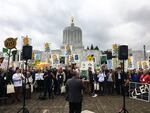 Hundreds of people protest in favor of cap-and-trade legislation at the Oregon Capitol in Salem, Oregon, Wednesday, Feb. 6, 2019. The bill aims to limit carbon emissions.