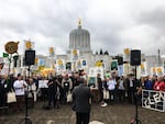 Hundreds of people protest in favor of cap-and-trade legislation at the Oregon Capitol in Salem, Oregon, Wednesday, Feb. 6, 2019. The bill aims to limit carbon emissions.