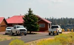 A house on the edge of Whychus Canyon is painted in pink on Aug. 27, 2025. Air support for the Flat Fire dropped fire retardant on homes along the canyon’s edge on Saturday, Aug. 23, 2025 as the fire blazed up the canyon toward hundreds of homes in the area.