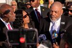Rodney Wells, right, stepfather of Tyre Nichols, speaks during a news conference with his wife RowVaughn Wells, center, and attorney Ben Crump, left, outside the federal courthouse Thursday after three former Memphis police officers were convicted of witness tampering charges in the 2023 fatal beating of their son in Memphis, Tenn.