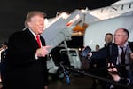 President Donald Trump speaks with reporters as he arrives on Air Force One, Saturday, Oct. 10, 2026, at Joint Base Andrews, Md.