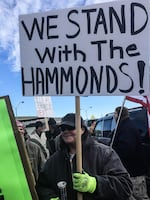 Protesters object to the sentencing of Oregon ranchers Dwight and Steven Hammond during a rally in Burns, Oregon, on June 2, 2016.