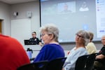 Neighborhood resource officer Alexa Graham takes questions during a "Coffee with a Cop" event at Pinney Library on July 18, 2022 in Madison, Wis.