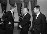 President John F. Kennedy, Attorney General Robert Kennedy and FBI Director J. Edgar Hoover talk at the White House.