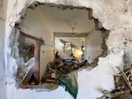 More than 20,000 people have now been killed in Gaza since the start of the war, according to Gaza's Ministry of Health. Above, a home in Rafah is shown in the aftermath of an Israeli airstrike.