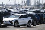 Toyota and Lexus cars unloaded from car carrier ships sit parked at the Toyota Logistics Services Inc. automotive processing terminal at the Port of Long Beach in Long Beach, Calif. on April 10, 2025.