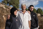 Hanan Khdour, 47, Ahmad Khdour, 64, and Hamed Khdour, 25, stand together at the site of killing of their brother and son Mohhamad, 17, in the outskirts of Biddu, the West Bank, on Sept. 19, 2024. Mohhamad, 17, and his cousin Malek Mansour, 16, also from Biddu, were driving in the hills not too far from their home in February 2024, when a man shot at their car from a distance as they were driving back. The boys had taken a break from studying to hike and picnic in nature.