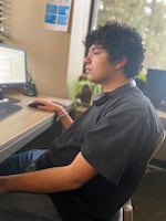 Eddie Lopez, 17, of Bend, Ore., responds to a text from a young person who said they felt unloved on Feb. 7, 2024. Lopez, who hopes to pursue a career in music, told the texter they were courageous for reaching out and helped them find contact information for local mental health care providers.

