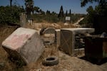 Concrete blocks placed by Israeli soldiers after October 7, 2023, according to local residents, are seen at one of the entrances of the village, impeding access for Palestinians in the West Bank village of Sinjil, Wednesday, July 9, 2025.