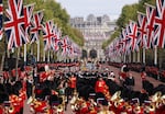 The Queen's funeral cortege borne on the State Gun Carriage of the Royal Navy travels along The Mall on Monday.