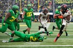 With the Oregon Ducks leaving for the Big 10, questions abound and the future of traditions like the Civil War rivalry game become uncertain. In this Nov. 30, 2019 file photo, Oregon State Beavers running back Jermar Jefferson (22) breaks a tackle at Autzen Stadium in Eugene.