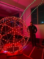 Light show programmer and designer Matt Schilling stands next to the “stunt cherry” that will be dropped at the stroke of 9:00 p.m. this New Year’s Eve in Milwaukie, Ore.