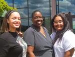 Adrienne C. Nelson High School is the name of North Clackamas school district's newest high school. Justice Nelson (center) stands at the site with members of Clackamas High School's Black Student Union who advocated for the school's name.  Brianna Gibson, Vice President (left) and Kaylee Hicks, President (right).