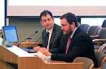 FILE: State economists Mark McMullen, left, and Josh Lehner answer questions from Oregon lawmakers at the state Capitol in Salem, Ore., on Aug. 26, 2015. The state will send a massive $5.6 billion kicker rebate back to taxpayers next year.