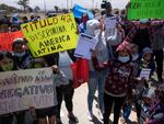 Migrants and asylum seekers protest outside the United States Consulate against the public  health order known as Title 42, in Tijuana, Mexico, on May 19, 2022.