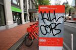 Anarchists slashed tires and vandalized the BIKETOWN station at Pioneer Courthouse Square, May 1, 2017.